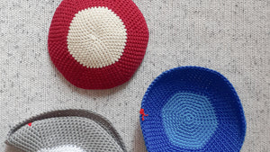 Penelope D Judaica, 3 Duo Colour Kippot on a grey knit flatlay. Grey & White, Raspberry & Ivory, Sky & Blue colour combinations.