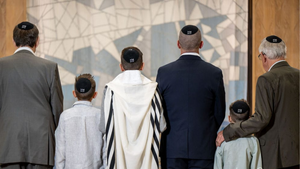 A family wearing black crochet kippot